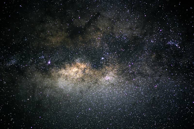 The Milky Way galaxy glowing with dense stars and cosmic dust in space