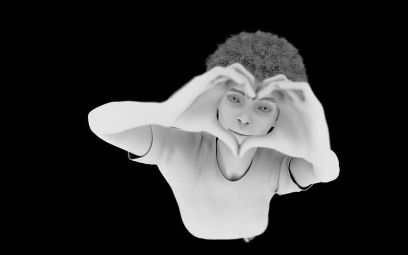 Person making heart shape with hands