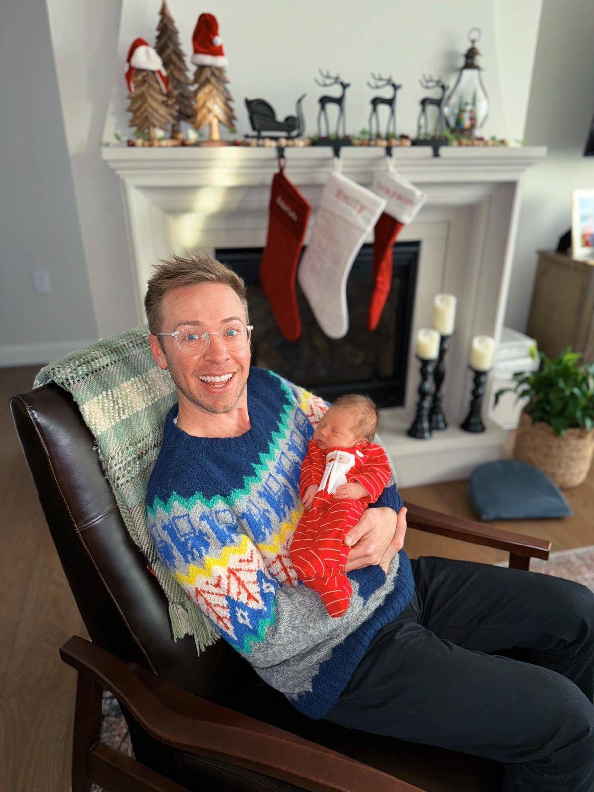 Nick Gray carrying his sister's baby during Christmas day