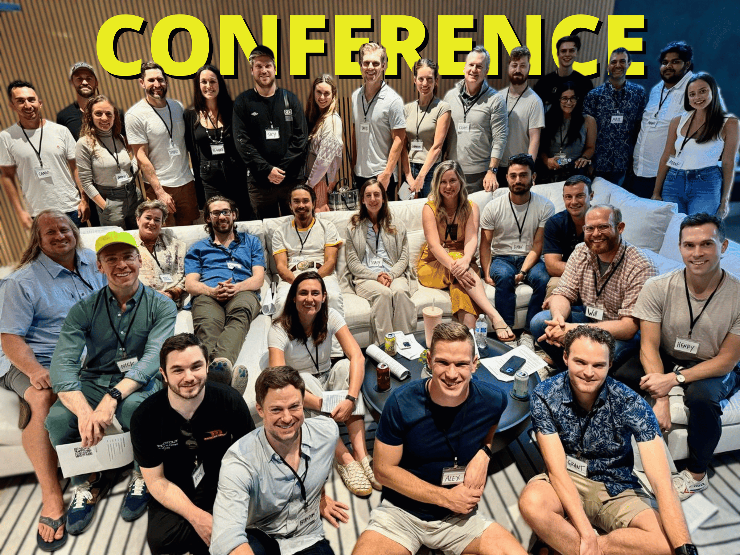 A group photo from a conference with all the guests wearing name tags