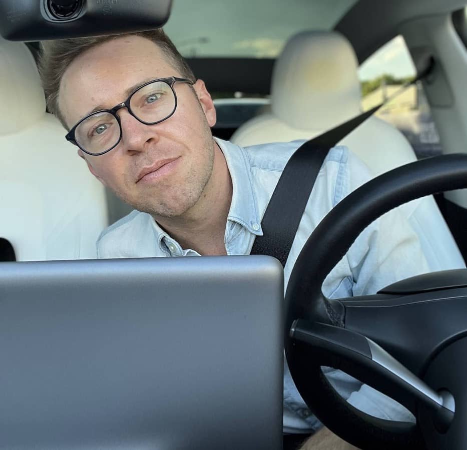 a selfie of Nick Gray inside his Tesla Model Y 