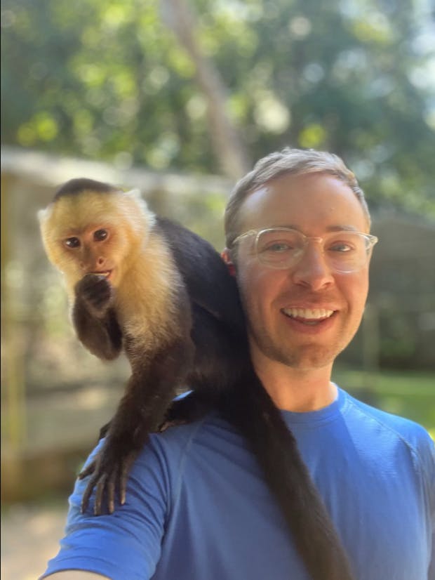 Me with a "wild” capuchin monkey on my shoulder in Roatan, Honduras last week