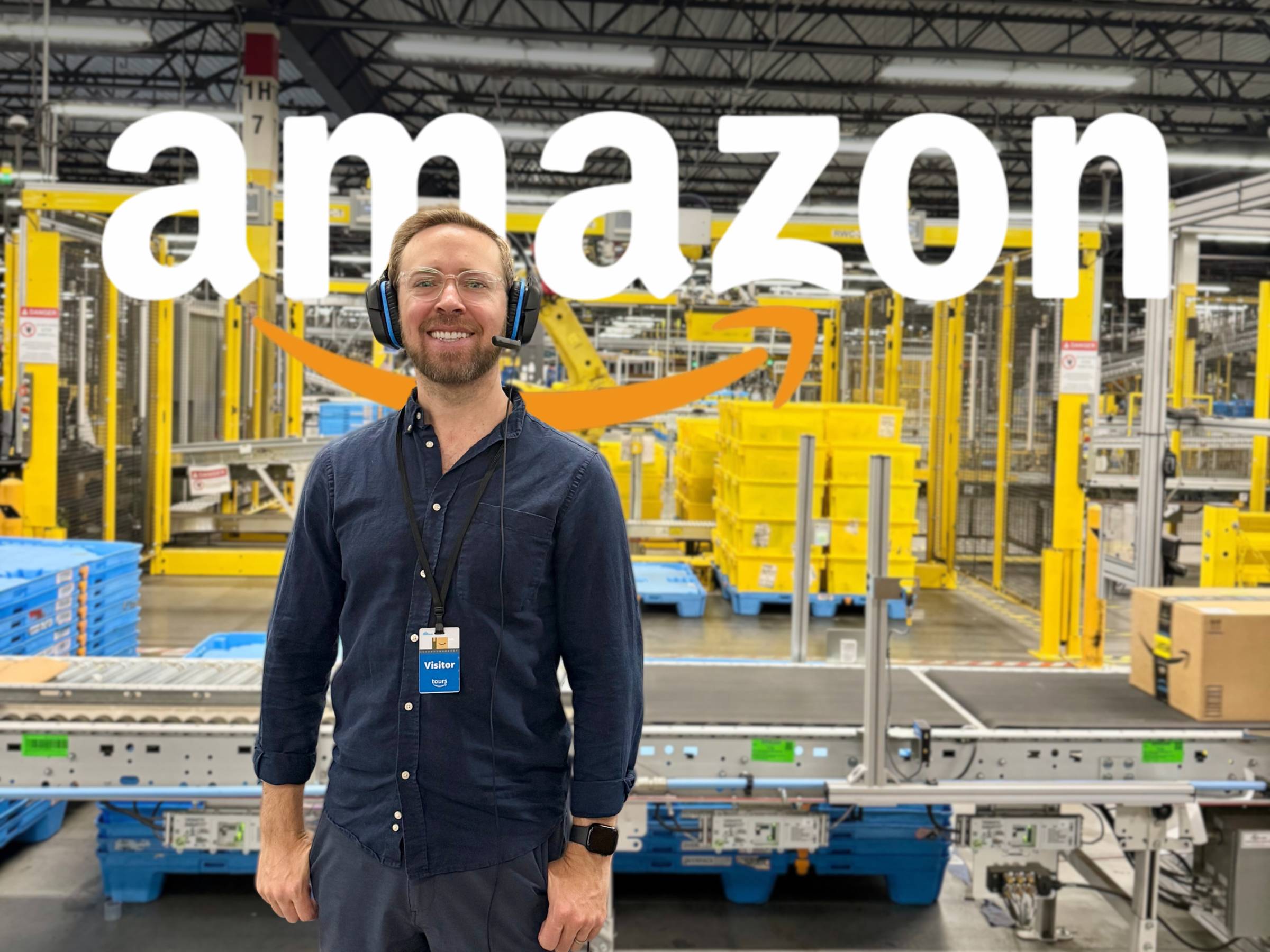 Nick standing inside the fulfillment center wearing a headset
