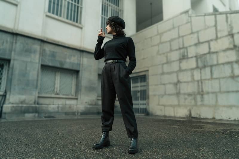 A woman standing in front of a building