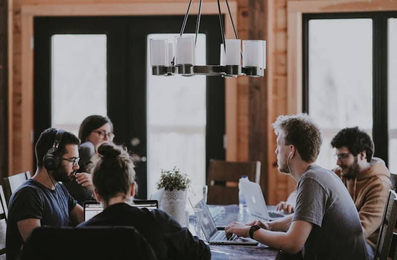 people around table inside room