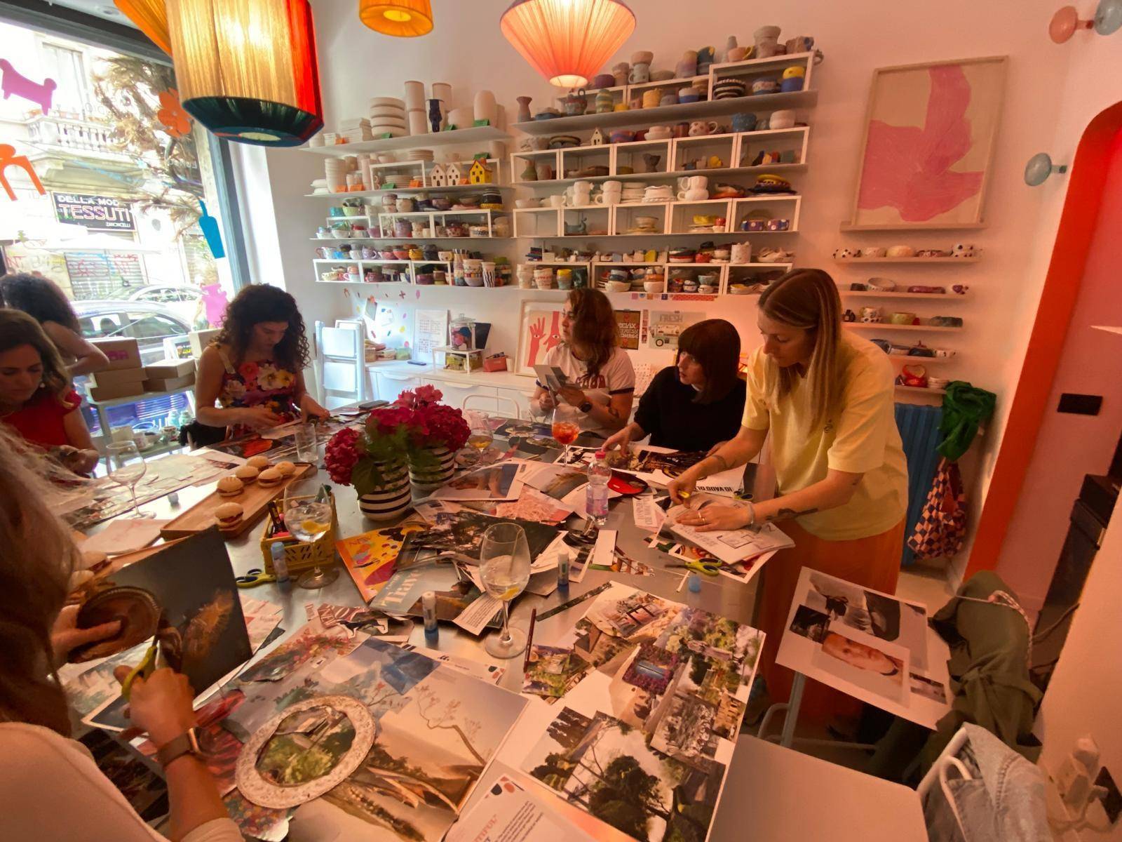 People working together on Vision Boards around a large table