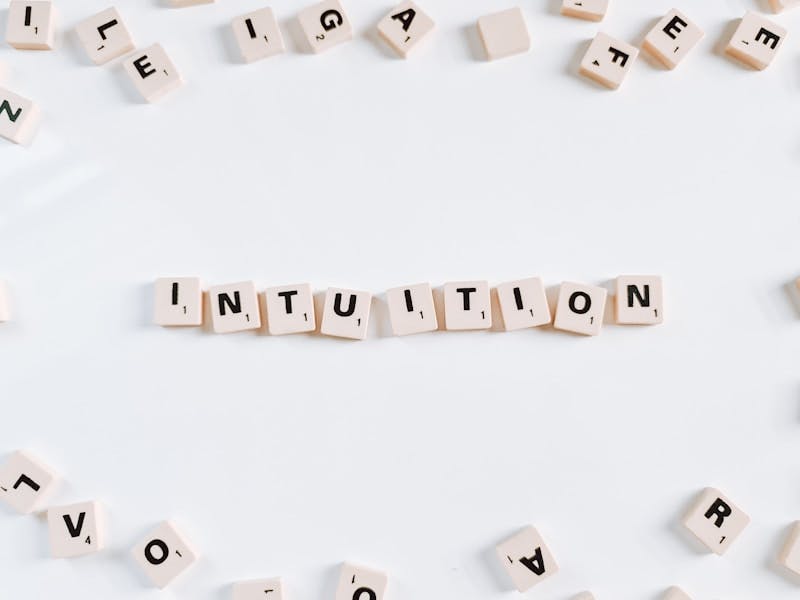 The word "intuition" spelled out in Scrabble letters