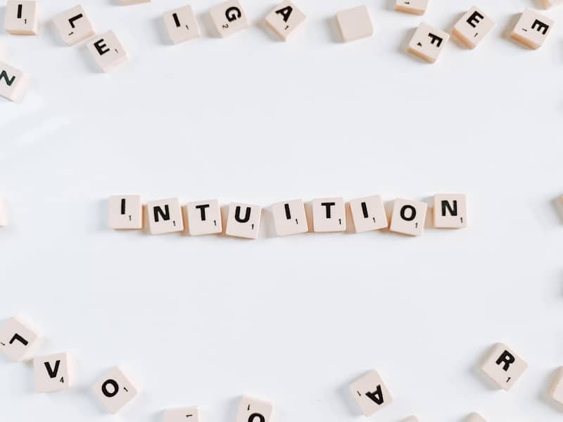 The word "intuition" spelled out in Scrabble letterss