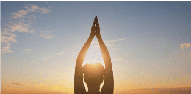 A healthy person facing the sun