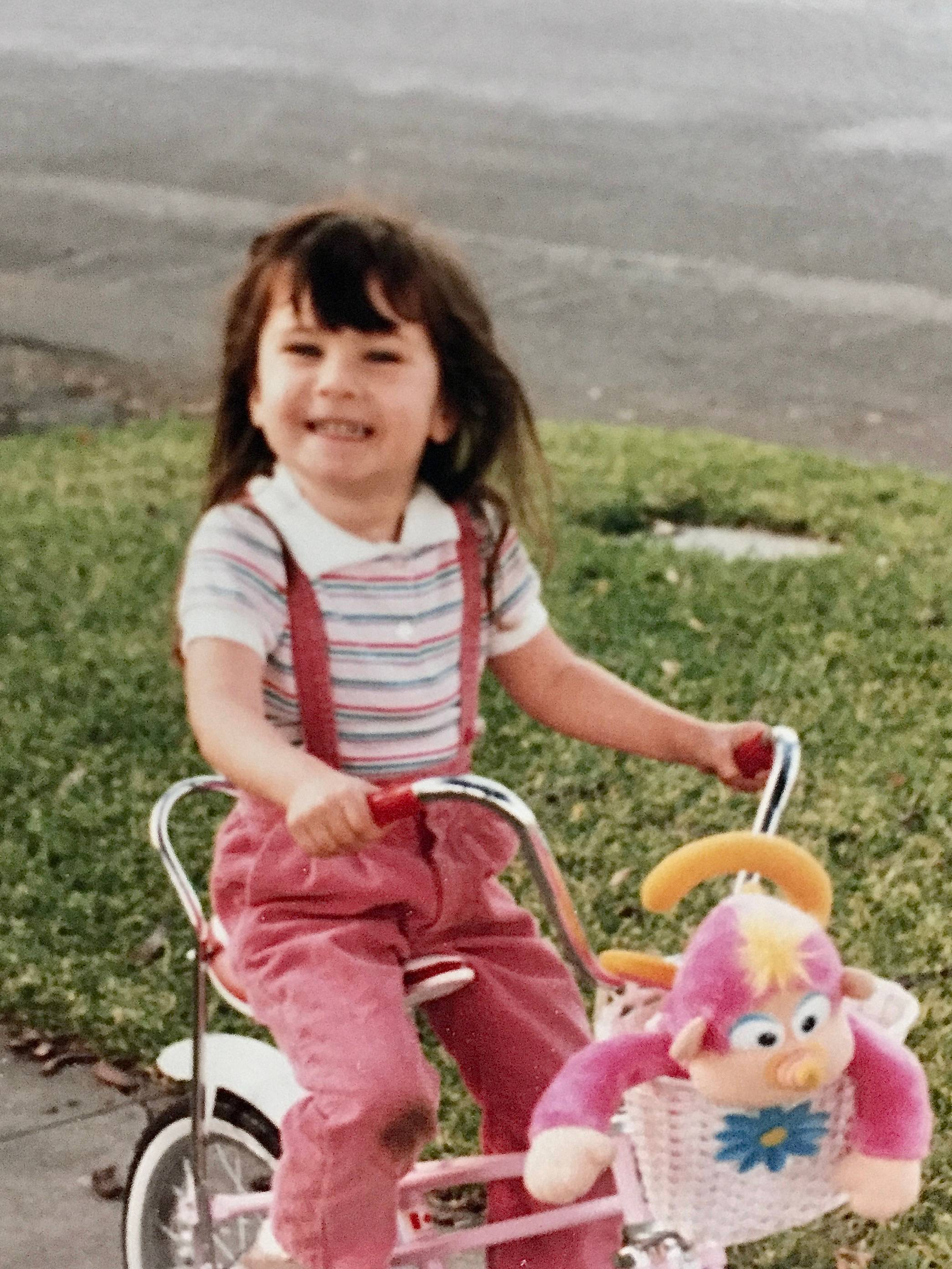 young girl on a bicycle