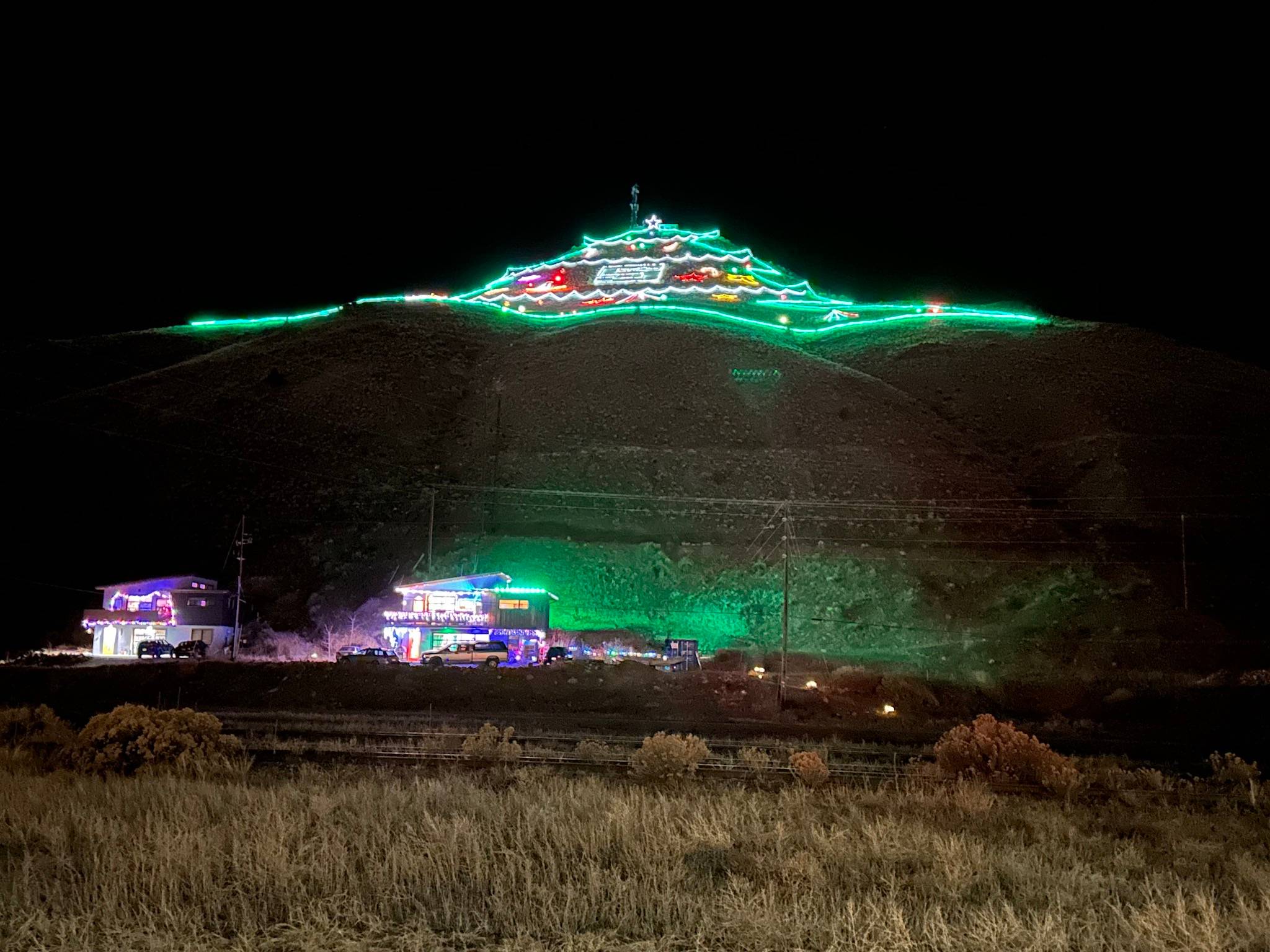 lit up Christmas Tree on mountain in downtown Salida