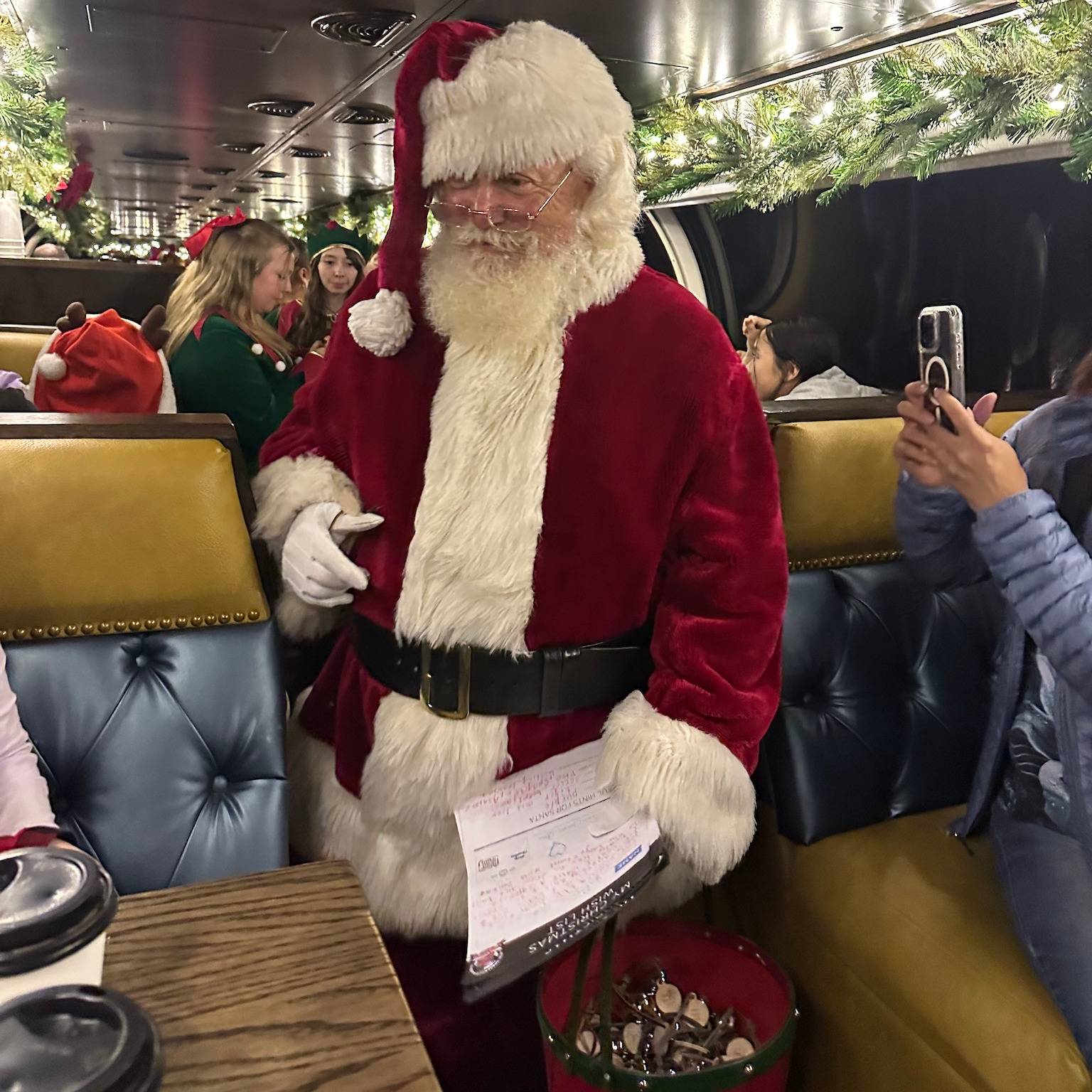 Santa Claus hands out bells on the Royal Gorge Route Railroad in Canon City