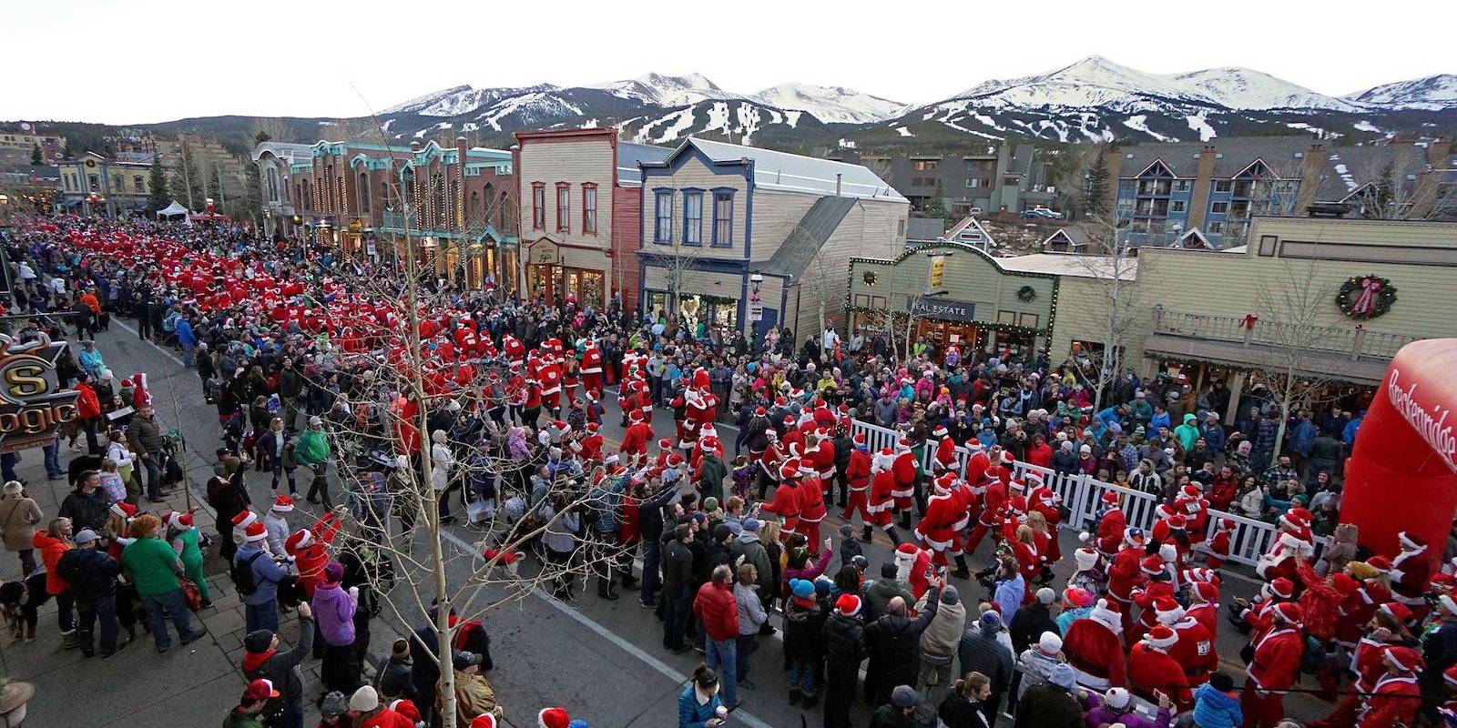 Santa Clauses race down the main street in Breckenridge