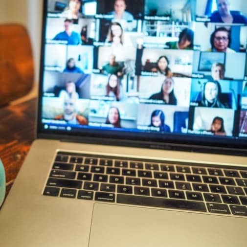 macbook pro displaying group of people