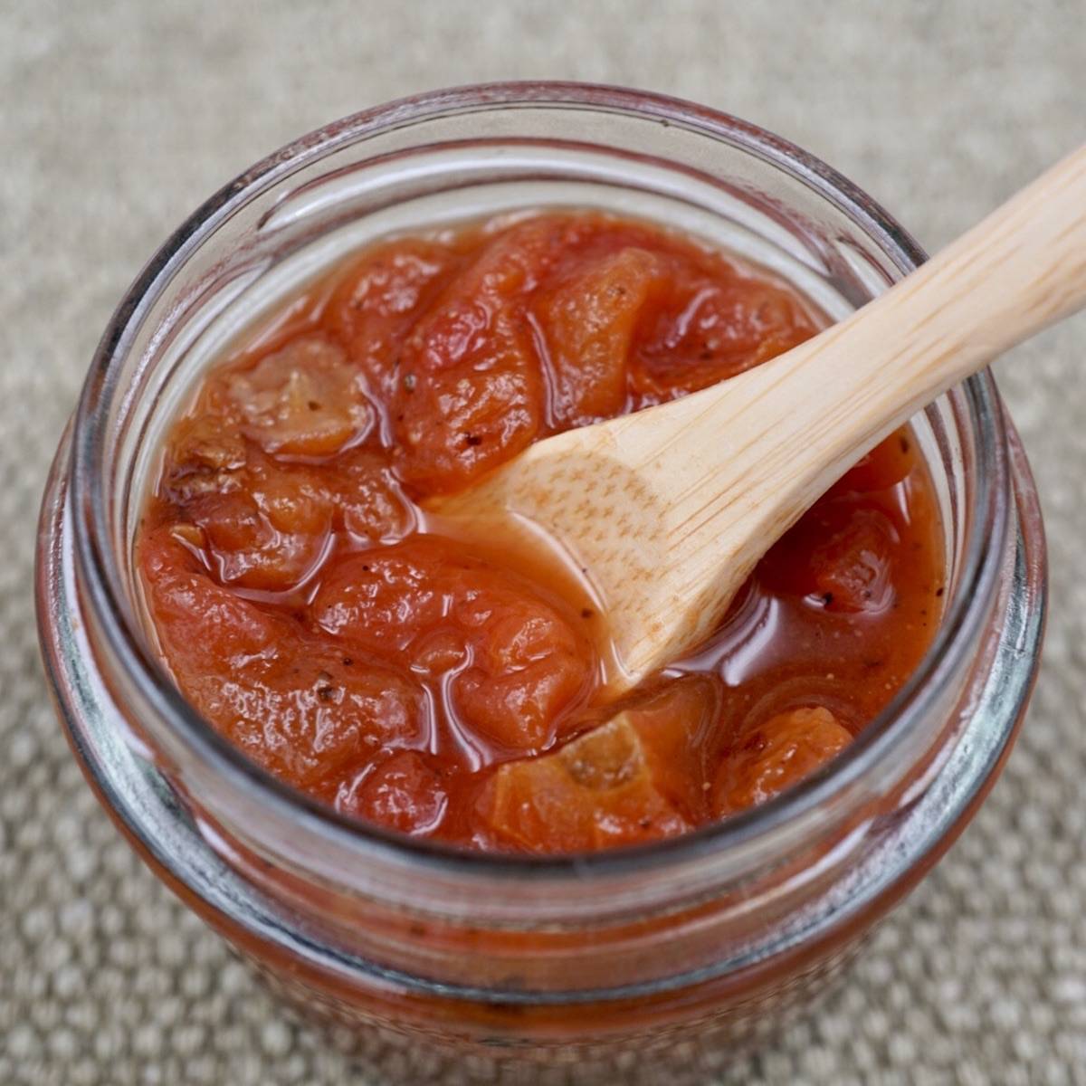 A jar of tomato chutney. 