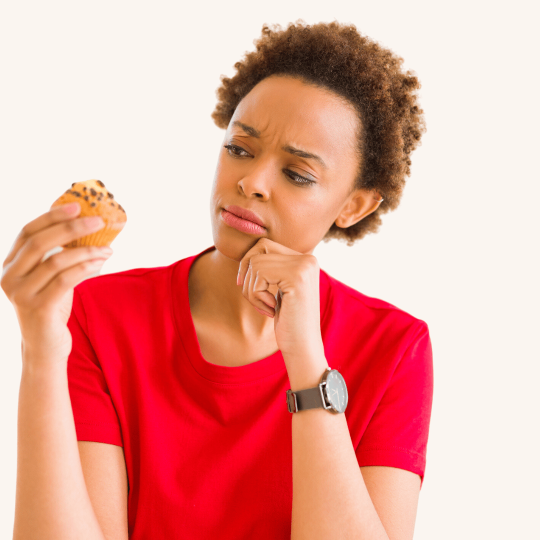woman in blue cap and red sleeveless dress