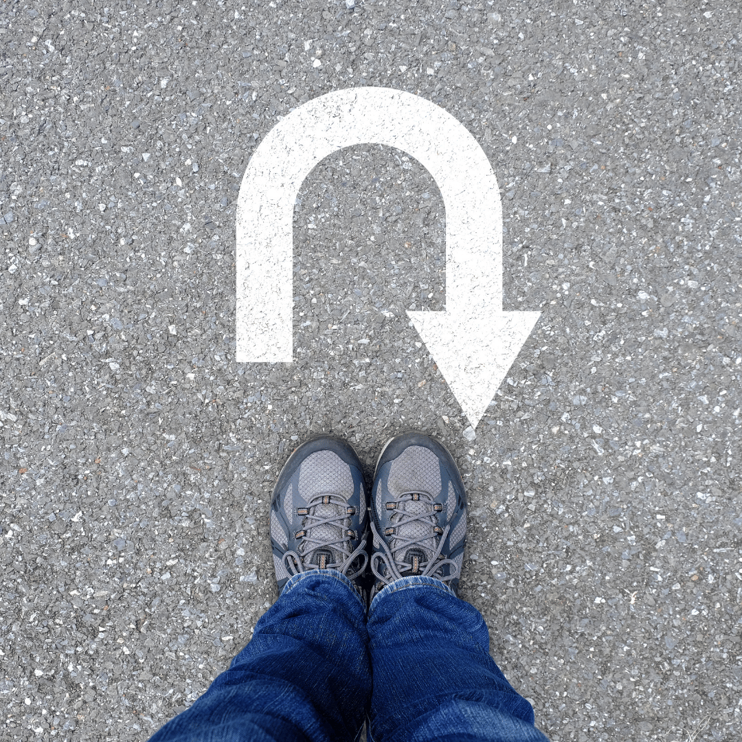 woman in blue cap and red sleeveless dress