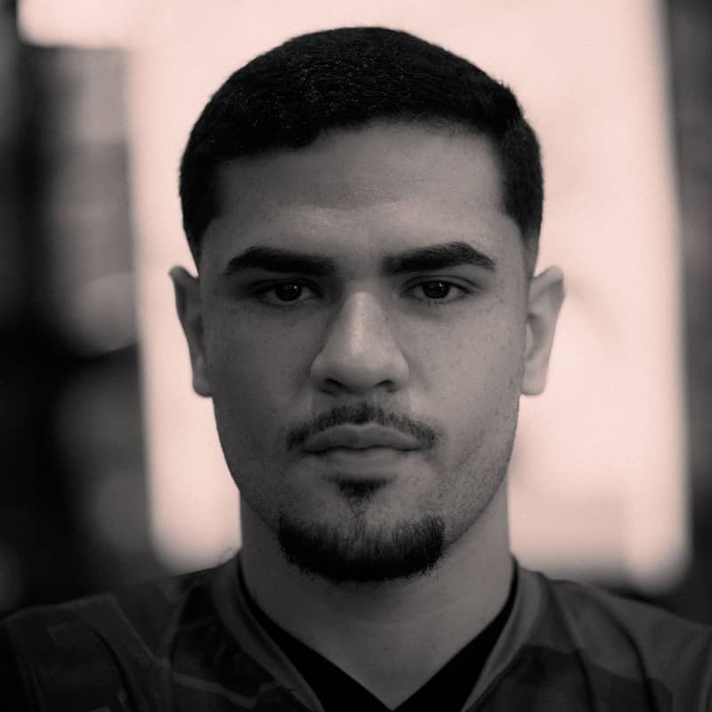 A young man with a serious expression