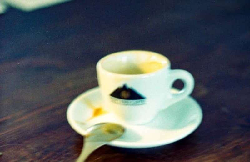 Espresso cup and saucer with spoon on table