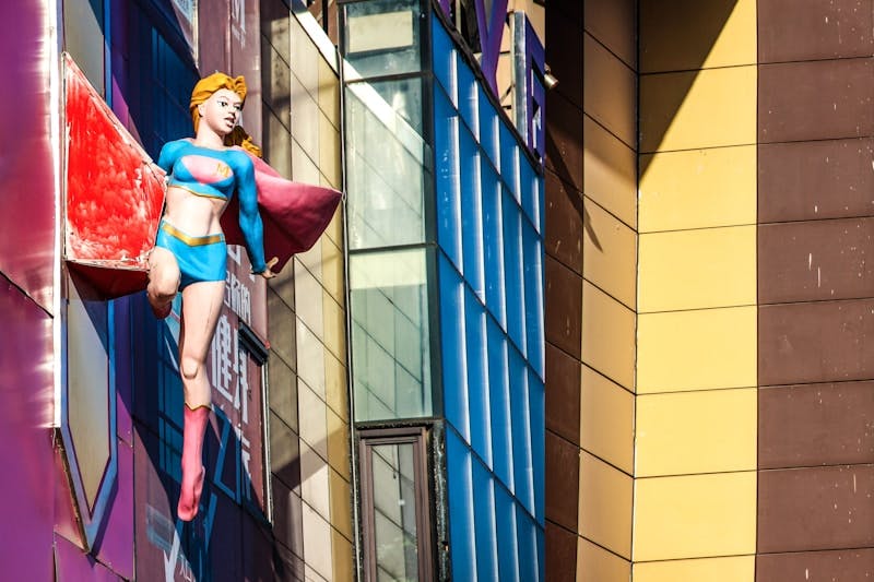 superwoman doll on a building