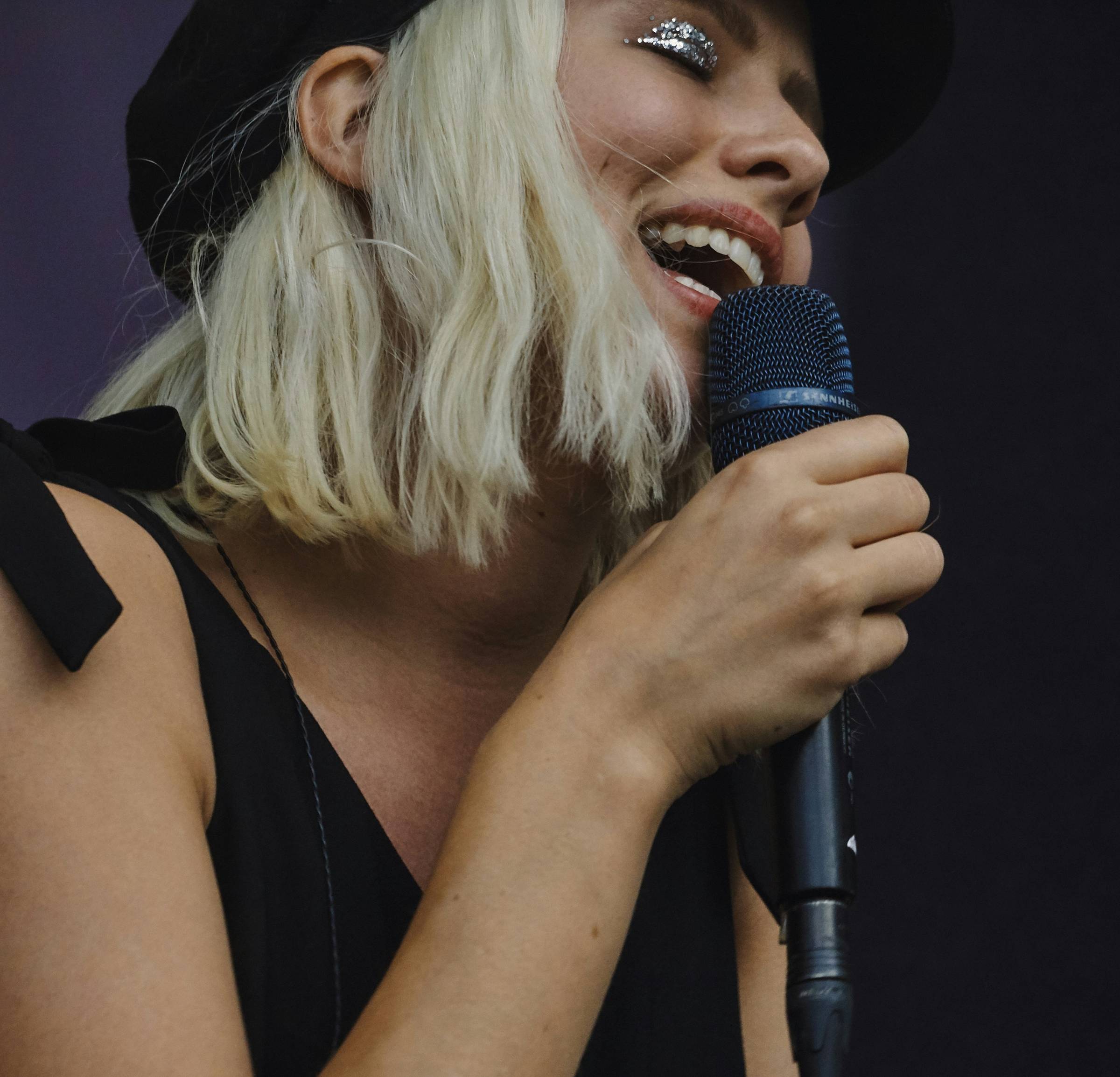 woman singing with a microphone