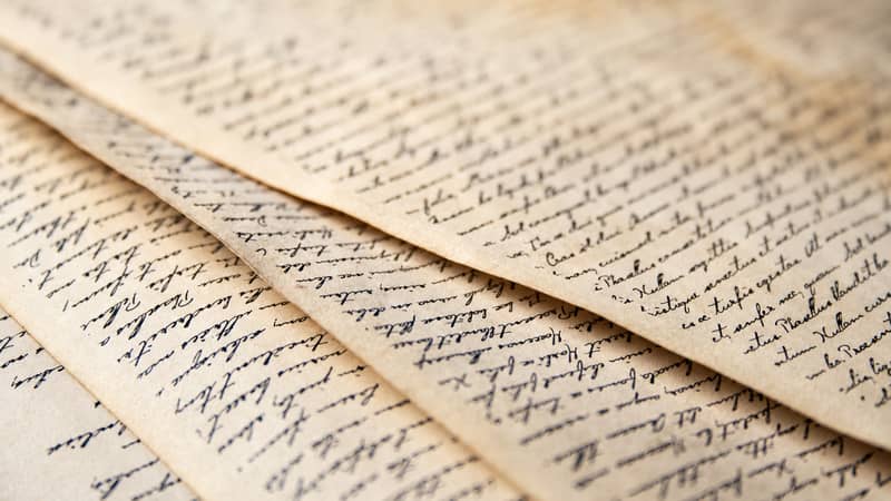 Handwritten pages representing writing and authorship