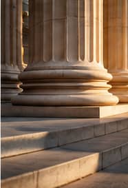Stone columns representing institutional accountability