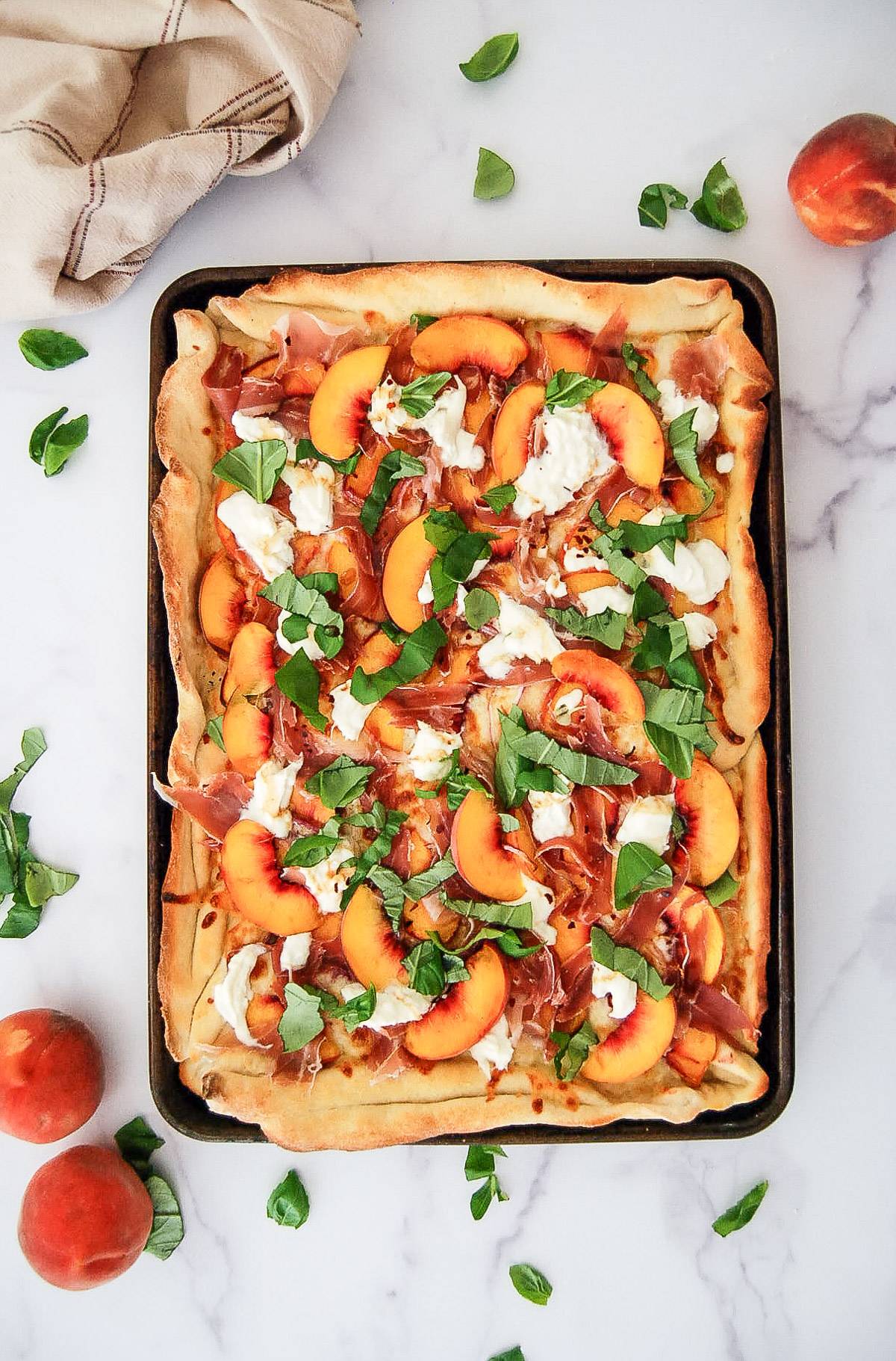 peach pizza with burrata and proscuitto