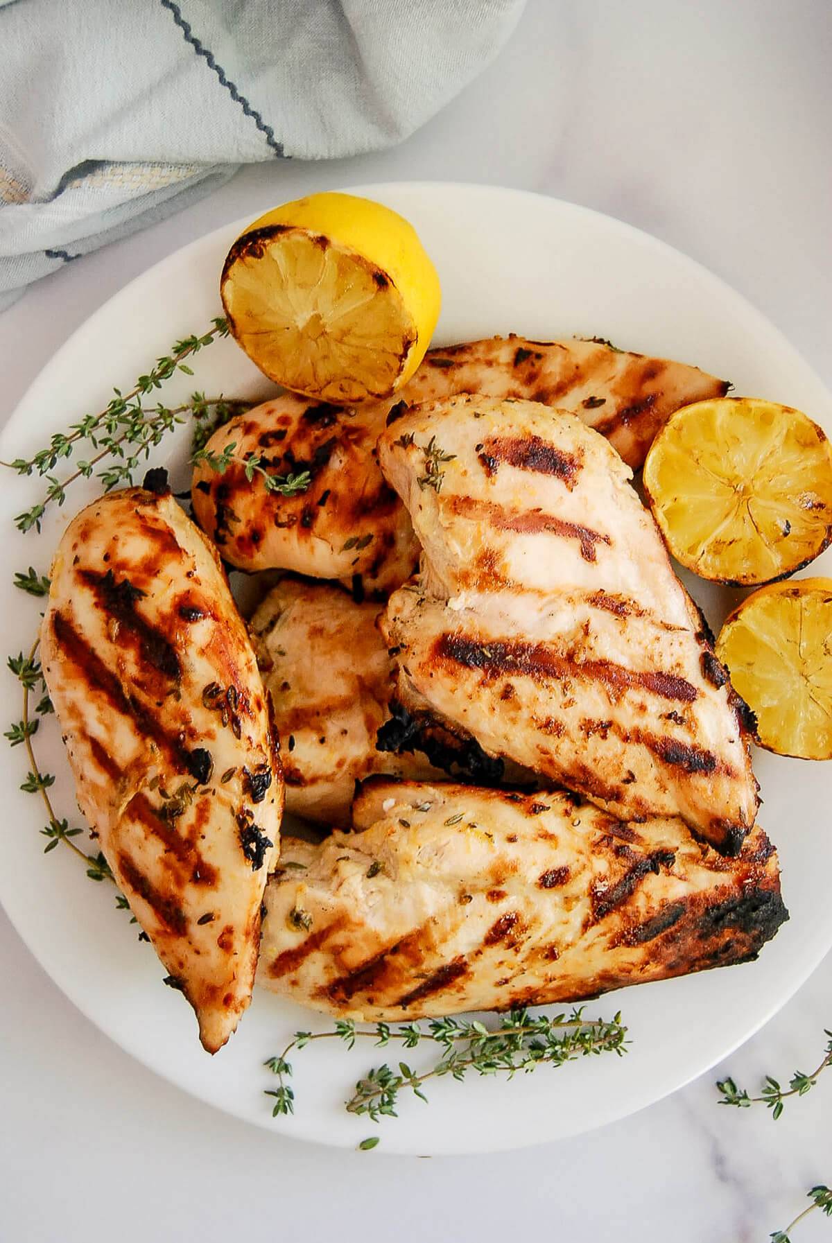 grilled lemon chicken on plate.
