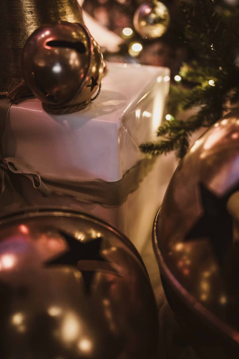 Christmas ornaments and wrapped gifts under tree