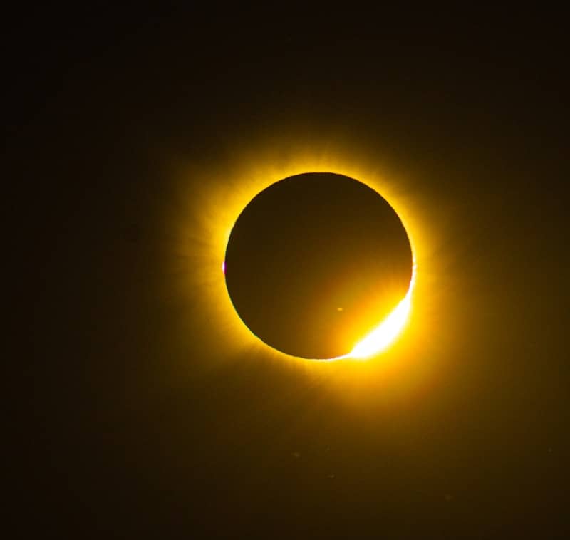 A total solar eclipse with a bright ring of light against a dark sky