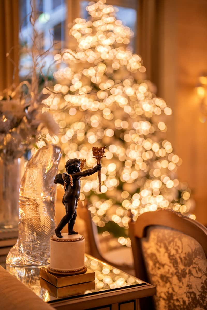 a statue of a person holding a torch on a table