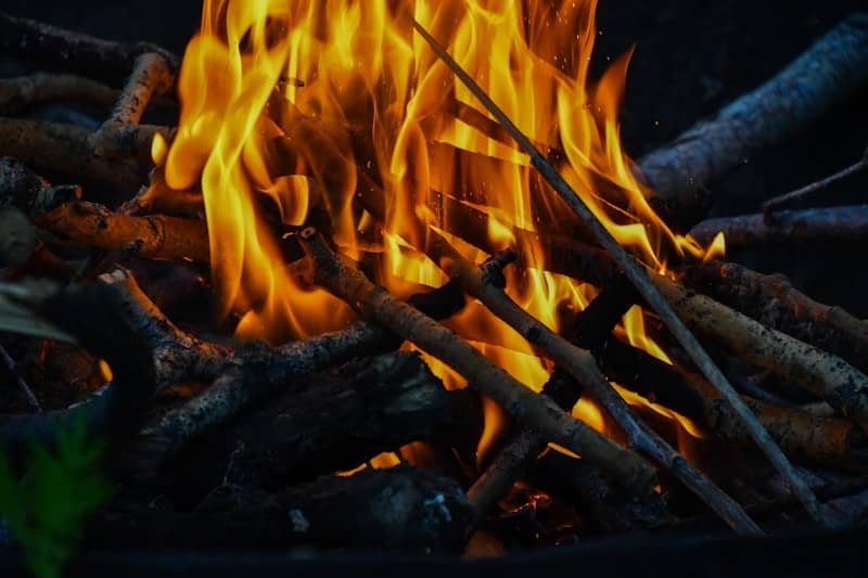 A campfire burns brightly with flames.