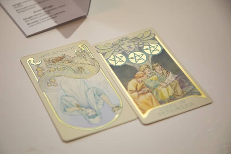 Two tarot cards displayed on a surface.