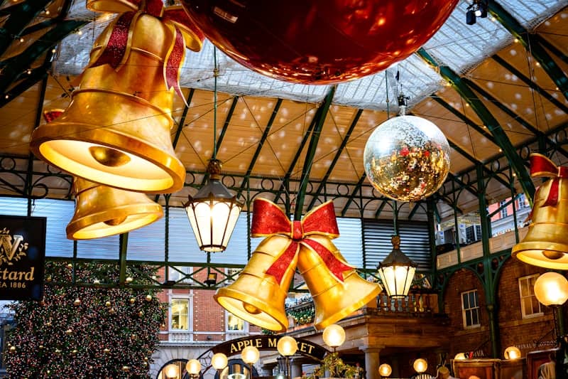 Golden bells and festive decorations hang indoors