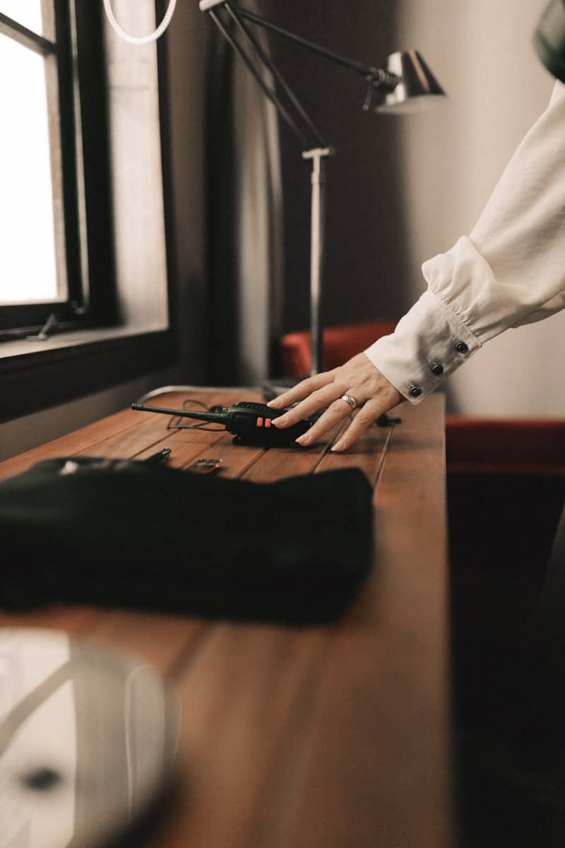 A person with their hand on a mouse pad