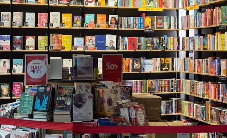 Bookshelves filled with fiction and nonfiction books.