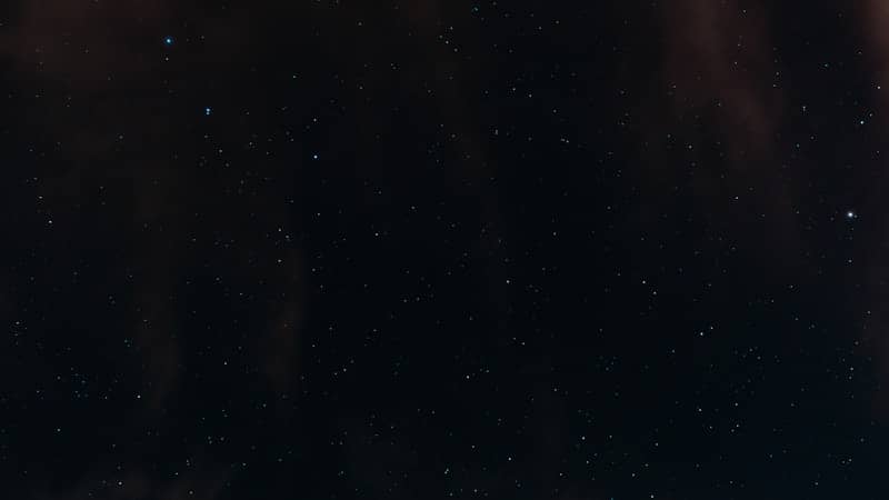 Stars shine brightly against a dark backdrop.