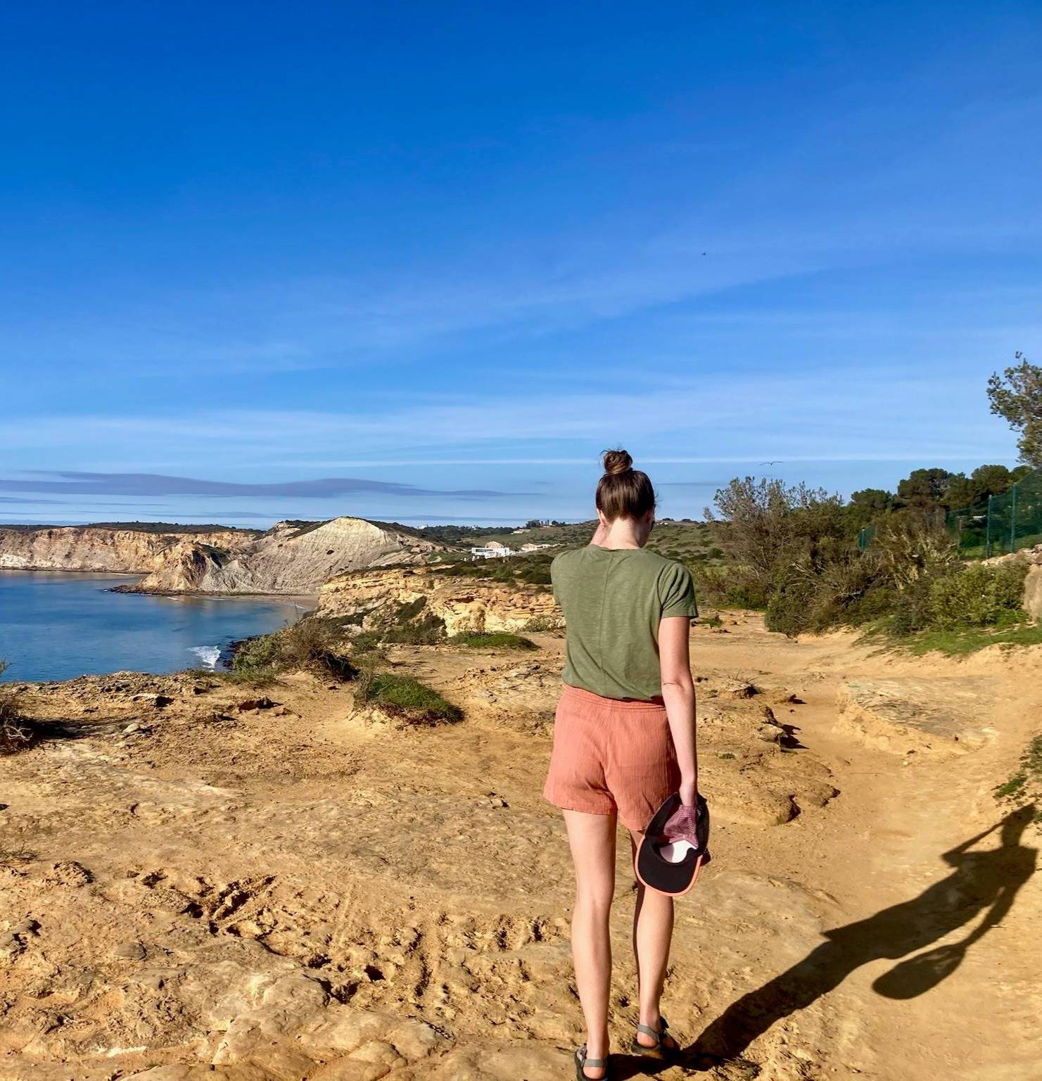 Stacy walking on a cliff