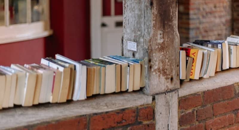 A row of books sitting on the side of a building