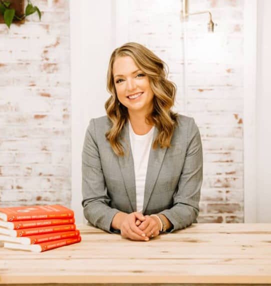 Stacy Ennis with her co-authored book Growing Influence