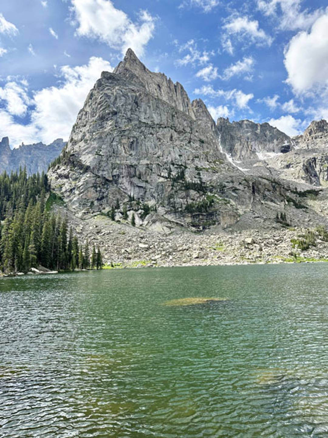 alpine lake with a mountain in the background