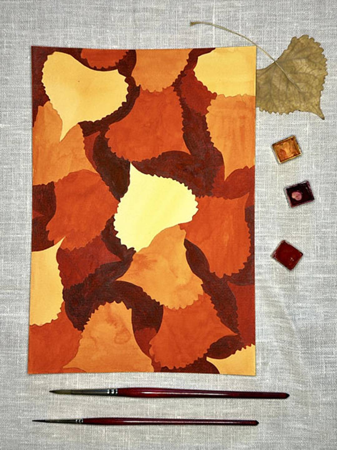 negative space painting of fall leaves in fall colors