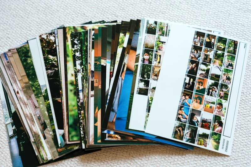 A stack of printed photographs fanned out.