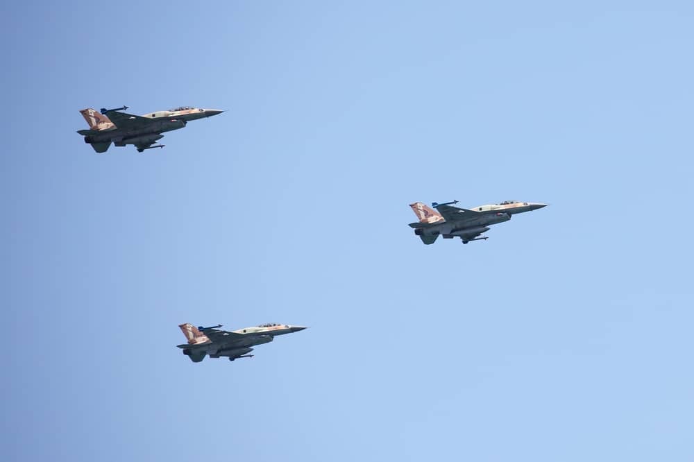Israeli Air Force F-16 planes fly in formation over the Mediterranean Sea.