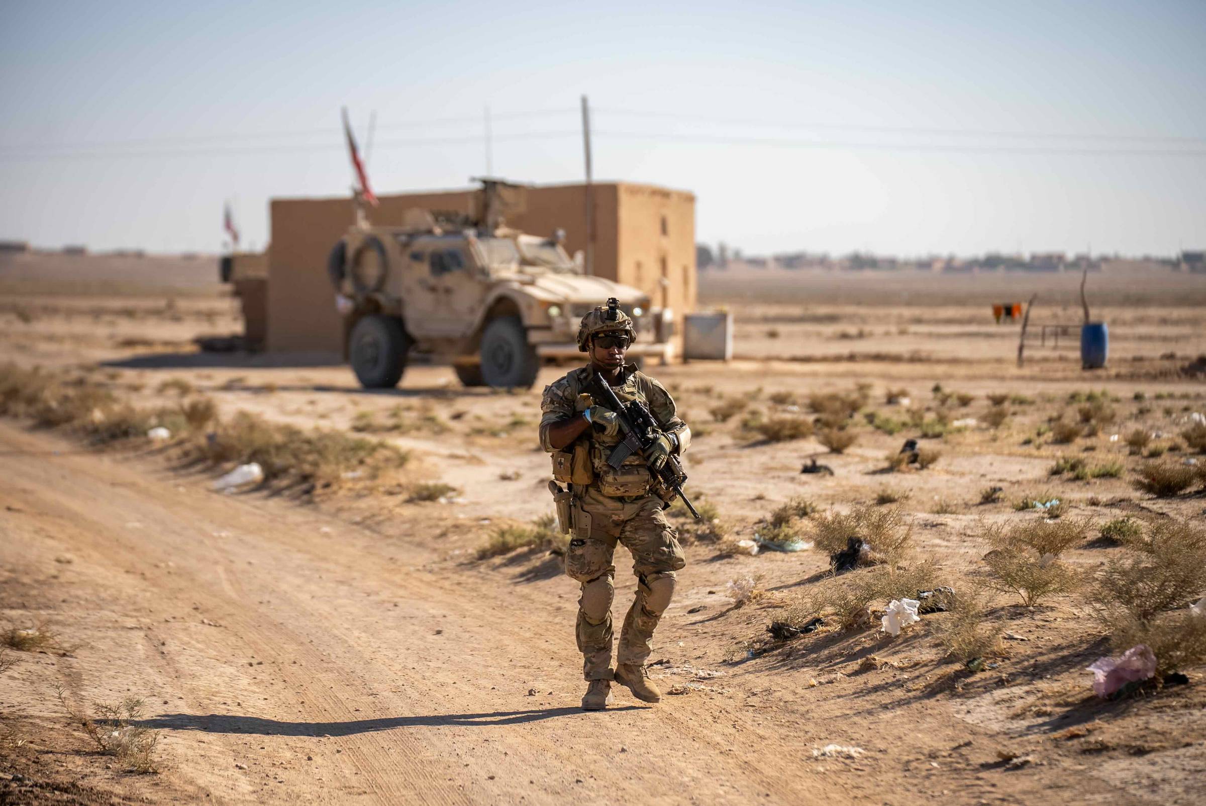 A U.S. Army Soldier assigned to Combined Joint Task Force - Operation Inherent Resolve, conducts a dismounted patrol through a village in Northeast Syria, circa 2024. (U.S. Army photo by Staff. Sgt. Emma Scearce)