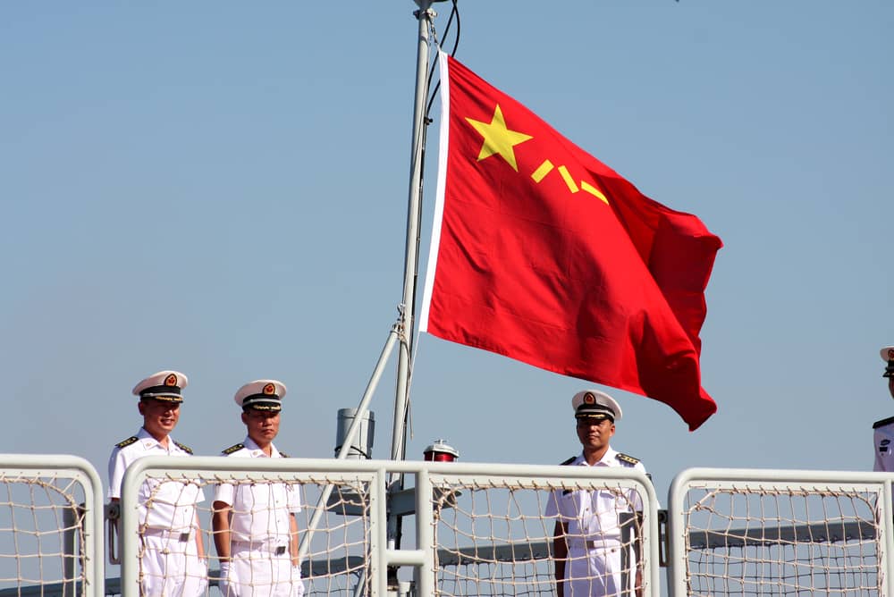 Chinese People's Liberation Army Navy sailors aboard a Type 052B Guangzhou-class destroyer. (Credit: Massimo Todaro / Shutterstock.com)