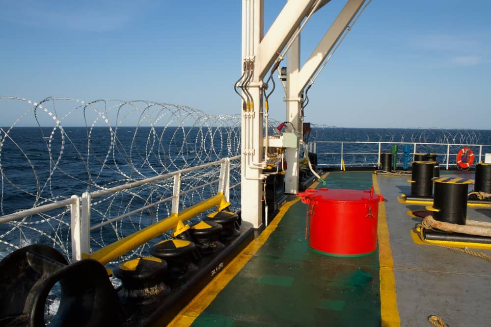 Razor wire lines the deck of a merchant vessel as an anti-piracy measure. (Credit: Antony Velikagathu / Shutterstock)