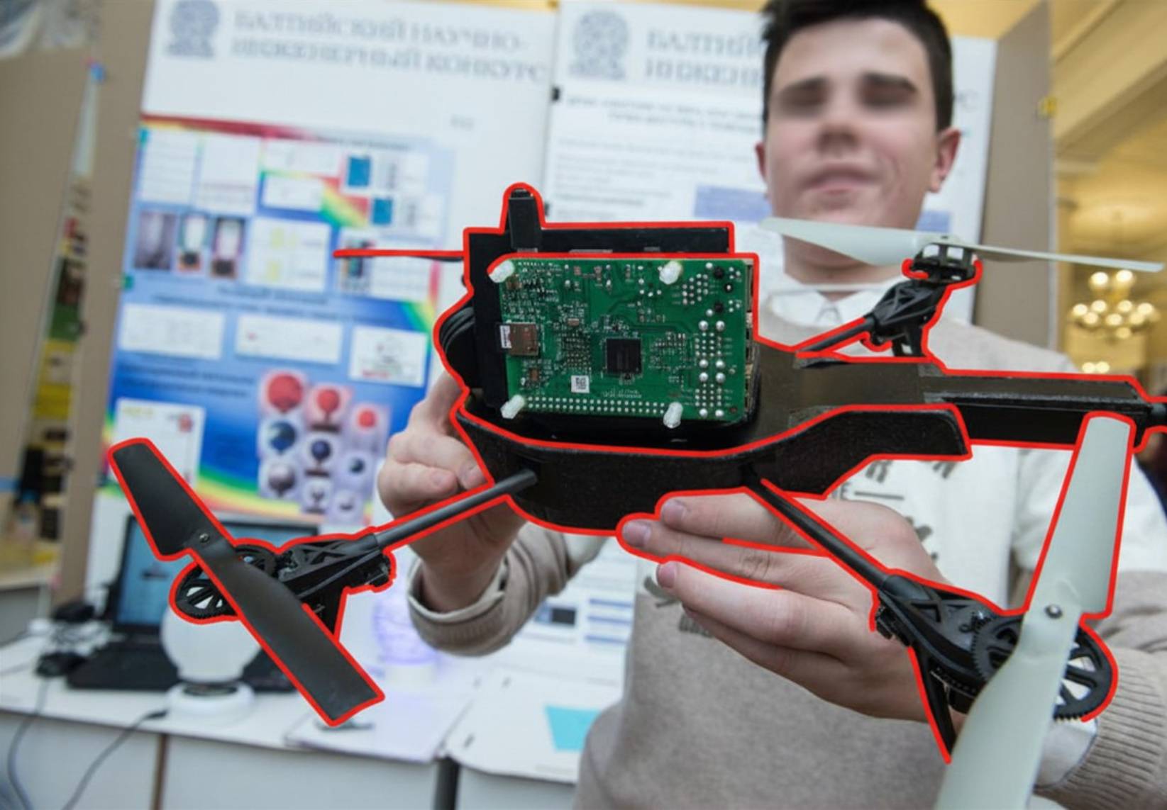 Illustrative image: A student displays a drone during a scientific engineering contest in St. Petersburg, Russia. (Akimov Igor / Shutterstock)
