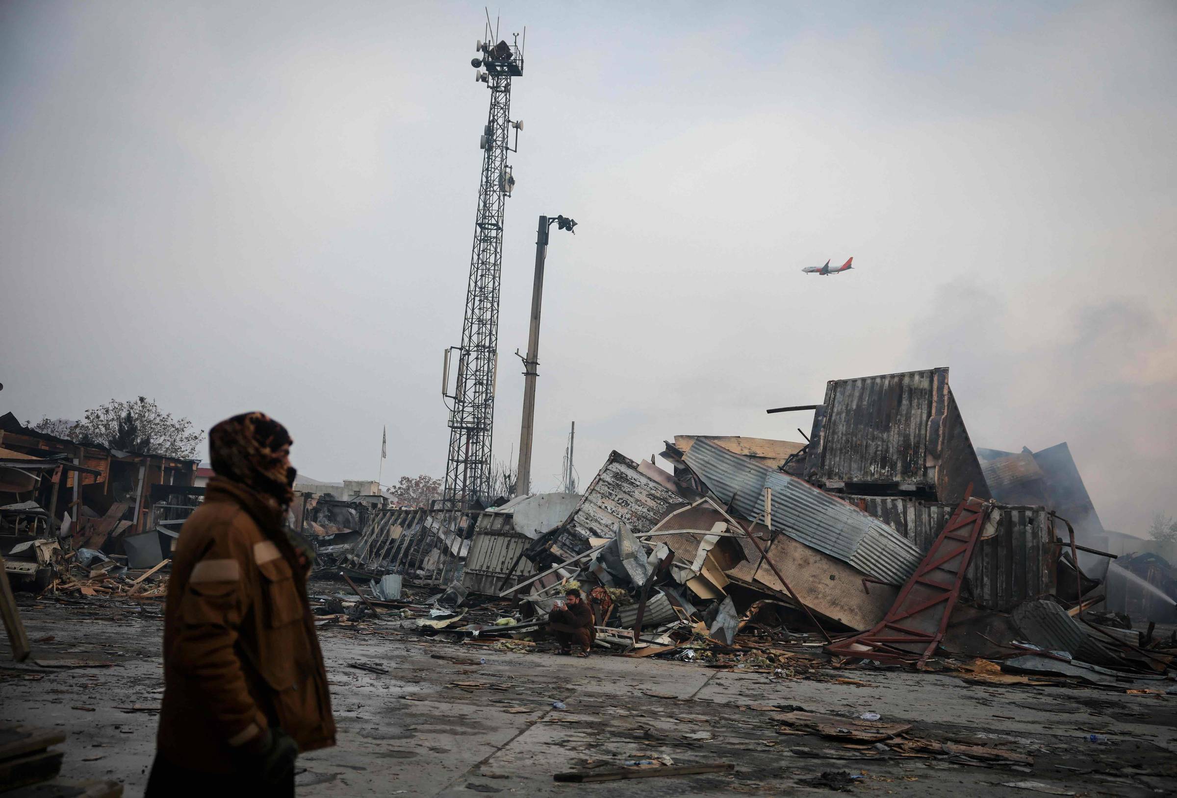 A man stands at the site of a drug users rehabilitation hospital destroyed in what the Taliban said was a Pakistani air strike in Kabul, Afghanistan, March 17, 2026. (REUTERS/Sayed Hassib)